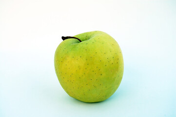 Fresh green apple with water droplets against a white background. For web & graphic design.