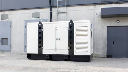 White auxiliary diesel generator for emergency power supply. Industrial generator connected to the control panel by a cable wire. Backup power supply of the generator. - obrazy, fototapety, plakaty