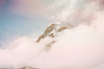 Georgia. Peak Of Mount Kazbek Covered With Snow And Clouds. Kazbek Is A Stratovolcano And One Of Major Mountains Of Caucasus. Amazing Georgian Nature Landscape In Early Winter.
