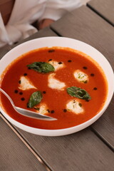 Table of italian meals on plates Pizza, pasta, ravioli, carpaccio, mushroom risotto, caprese salad and tomato bruschetta on rustic wooden background. Top view. Flat lay