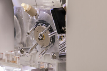 Detailed view of a transparant polymer pump on a sanger genetic analyser. Laboratory, DNA analysis, technology, sequencing, laboratory equipment, air bubbles, DNA, science, research and development