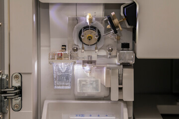 View of a transparant polymer pump on a sanger genetic analyser. Laboratory, DNA analysis, technology, sequencing, laboratory equipment, air bubbles, DNA, science, research and development