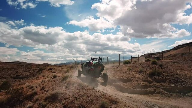 UTV driving on a dirt trail in the desert