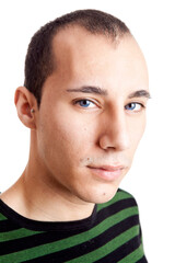 Naklejka premium Portrait of a confident young man with blue eyes, isolated on white