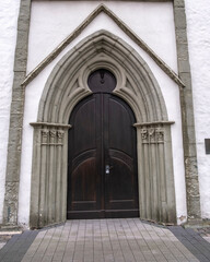 Fototapeta na wymiar White church ,architecture ,door, facade ,wall background in the old town of lippstadt germany