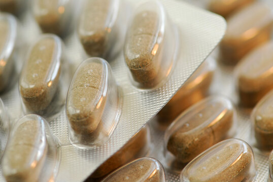 Packages of herbal supplement pills close up