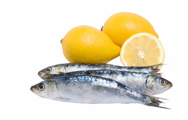 Close up off three sardines and lemons