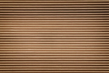 Horizontal corrugated brown cardboard texture, background.