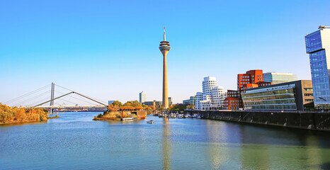 Fototapeta premium Beautiful rhine river skyline, tv tower, modern architecture, bridge in media harbor - Düsseldorf, Germany