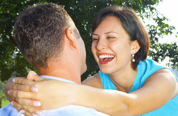 a portrait of attractive couple in summer environment