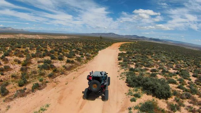 UTV driving on a dirt trail in the desert