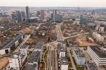 Naklejka na ściany i meble Drone photography of new high rise skyscrapers and old residential houses.
