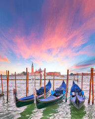Captivating  landscape with Church of San Giorgio Maggiore on background and gondolas parked beside the Riva degli Schiavoni in Venice © pilat666