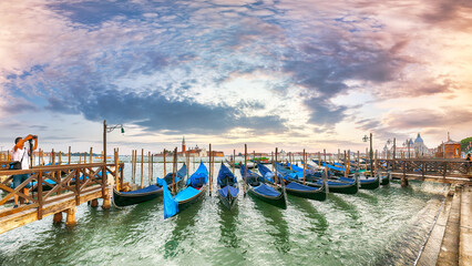 Captivating  landscape with Church of San Giorgio Maggiore on background and gondolas parked beside the Riva degli Schiavoni in Venice © pilat666