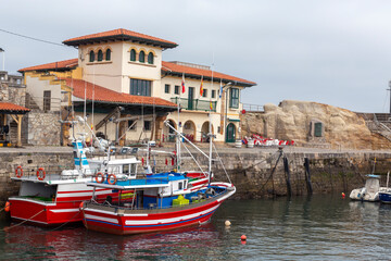 nice fishing port in the spanish town of comillas, cantabria.