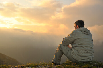 healthy young man practice youga in height mountain at early morning and sunrise