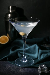 Glass of martini on dark background