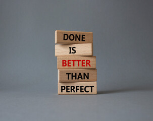 Done is better than Perfect symbol. Wooden blocks with words Done is better than Perfect. Beautiful...
