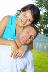 Fototapeta premium a portrait of attractive couple in summer environment