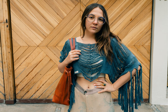 Portrait of beautiful young hippie woman in boho style