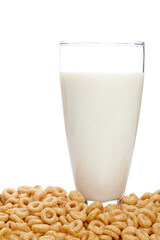 A fresh milk tumbler and cornflakes on white background. Shallow depth of field
