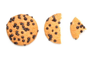 Whole and broken cookies with chocolate chips on white background