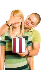 man surprising a woman with present over white background