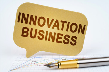 On the business diagram is a pen and a sign with the inscription - Innovation Business