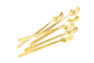 Golden spoons on white background