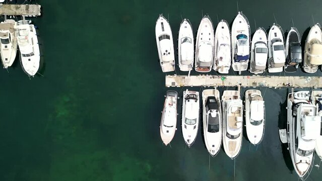 Sailing boat marina drone top-down shot, parked boats