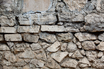 Old stone wall. Old construction or architectural background.