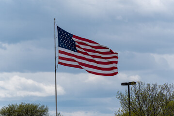 American Flag Flying In A Cloudy Sky