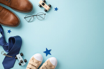 Celebrating Father's Day with a sweet gesture. Top view leather shoes, tiny sneakers, stars, toys, necktie with clip, and stylish spectacles on pastel blue background with empty space