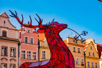  2022-08-02. glass red deer  emblem  Jelenia Gora city on the Town Hall Square. Poland