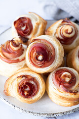 Puff pastry swirls. Close-up of puff pastry with prosciutto.