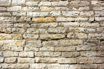 Wall made of natural light stone, texture, background.