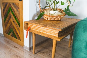 shot of a sophisticated handmade wooden decorative table in the living room. High quality photo