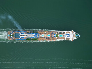 Aerial view large cruise ship at sea, Passenger cruise ship vessel, sailing across the Ksamil, Albania. View from drone.
