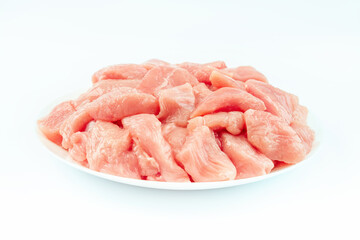 Fresh frozen pieces of turkey meat on a white background.Raw chicken.Frozen chicken fillet..Ogranic food and healthy eating.frozen turkey or poultry meat.