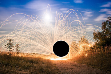Firetrail of sparks flying throught the air to create a vortex worm hole