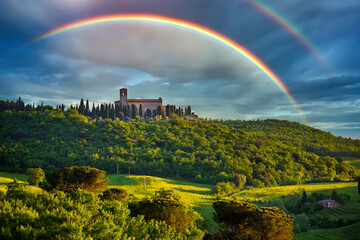Rainbow over Tuscany landscape at sunny evening, Italy