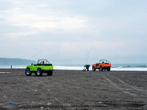 Colorful cars for tourists on Parangtritis Beach, Yogyakarta, Indonesia