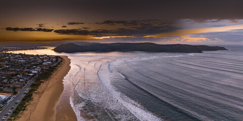 Sunrise panorama at the seaside with gentle surf