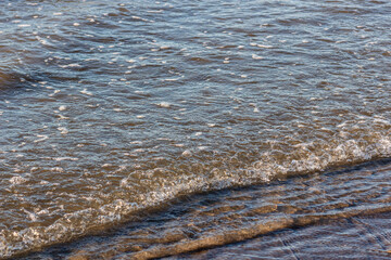 Gentle waves rippling on the seashore