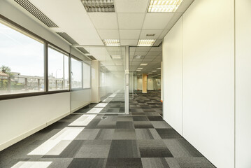 Some offices with glass partitions, large windows, technical ceilings