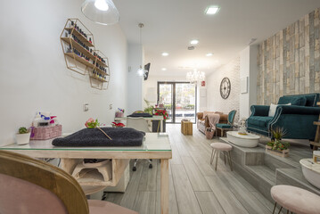 A beauty salon with stalls for grooming fingernails