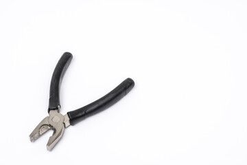 A pair of pliers with black rubber drinks on the handles on a plain white background