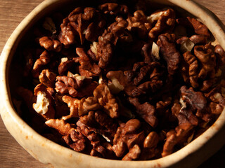 Peeled walnut lies in a bowl