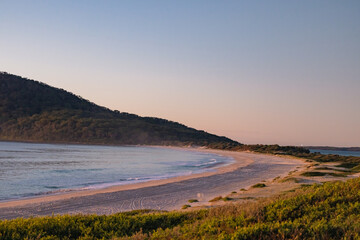 Fototapeta na wymiar Early morning, sunrise at Jimmy's Beach. Hawks Nest NSW Australia