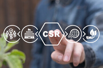 Man using virtual touchscreen presses abbreviation: CSR. Concept of CSR. Business and organization...